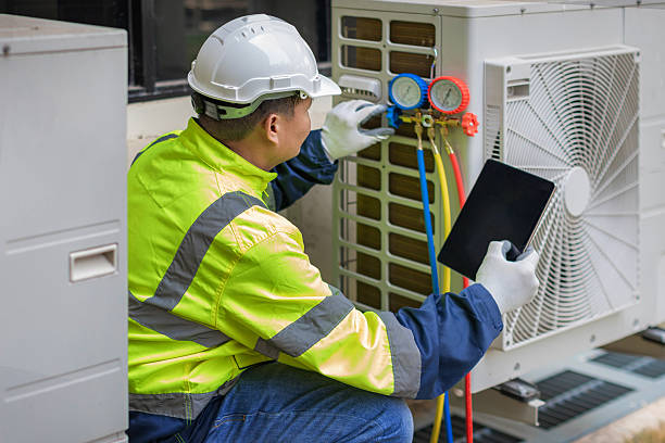 Professional Heat Pump Repair technician working in Pawcatuck, CT